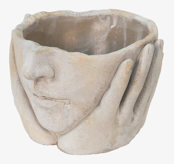 Foto: Skulptural ansiktskruka i grå cementlook, närbild
