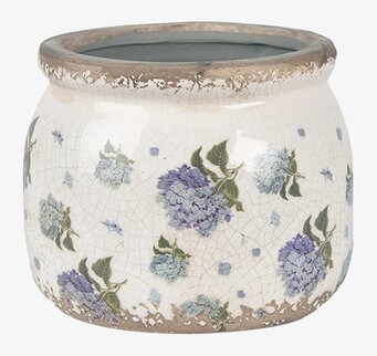 Foto: Krämvit kruka med blå blommor och krackelering