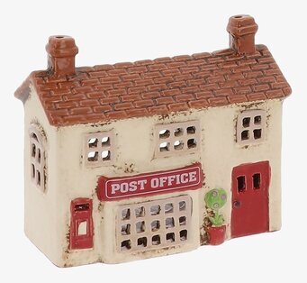 Foto: Husformad ljuslykta som postkontor frilagd