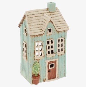 Foto av husformad ljuslykta i turkos keramikpanel