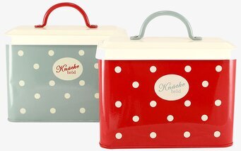 Bild av två dekorativa plåtburkar för köksinredning