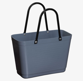 Foto på duvblå plastkasse med svarta handtag frilagd