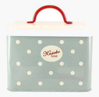 Bild av retroinspirerad grön plåtburk med prickigt mönster