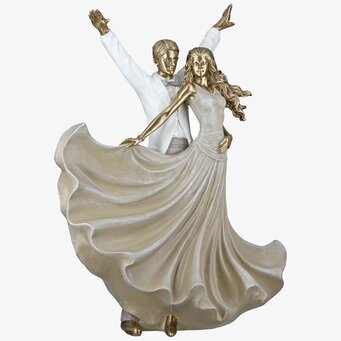 Foto: Dansande parskulptur i guld och beige salsa