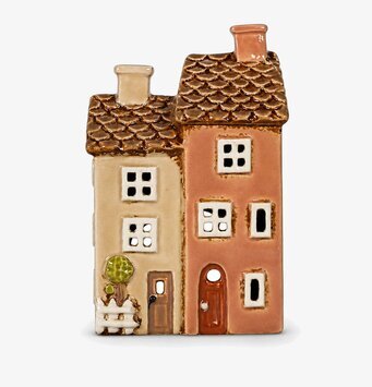 Foto av keramikljuslykta som två hus rosa/beige