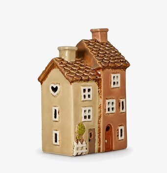Foto av keramisk ljuslykta som två hus rosa/beige