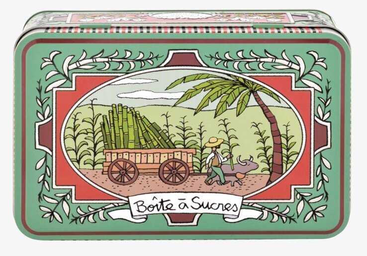 Bild av vintage plåtburk med pastoral scen i grönt och rött