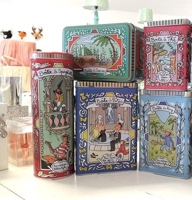 Bild av färgglada plåtburkar med unika illustrationer