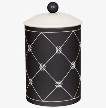 Foto av stilfull svart plåtburk med blommigt mönster