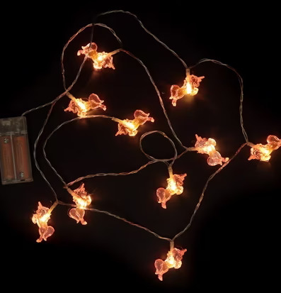 Enhörning LED Ljusslinga Rosa från Puckator på mörk yta