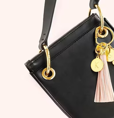 Reflextofs Aqua Deluxe från Firefly på svart handväska