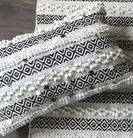 Boho Kudde Svart/Natur från Majas Cottage på trägolv