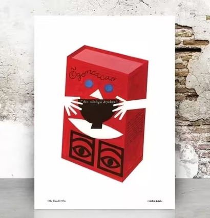 Ögon Cacao-1956-Red Box av Olle Eksell mot tegelvägg