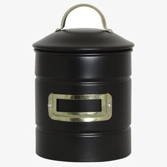 Bild av stilren plåtburk med svart och mässing detaljer