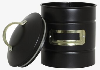 Bild av stilren svart plåtburk med mässingsdetaljer