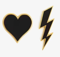 Firefly Reflex Pins Guld: Hjärta och Blixt på vit bakgrund