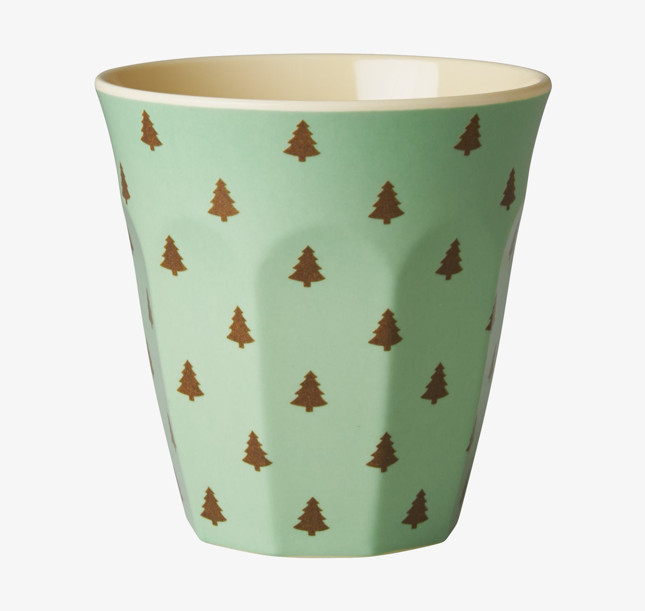 Bild av livfull mugg med julgranar och grön bakgrund