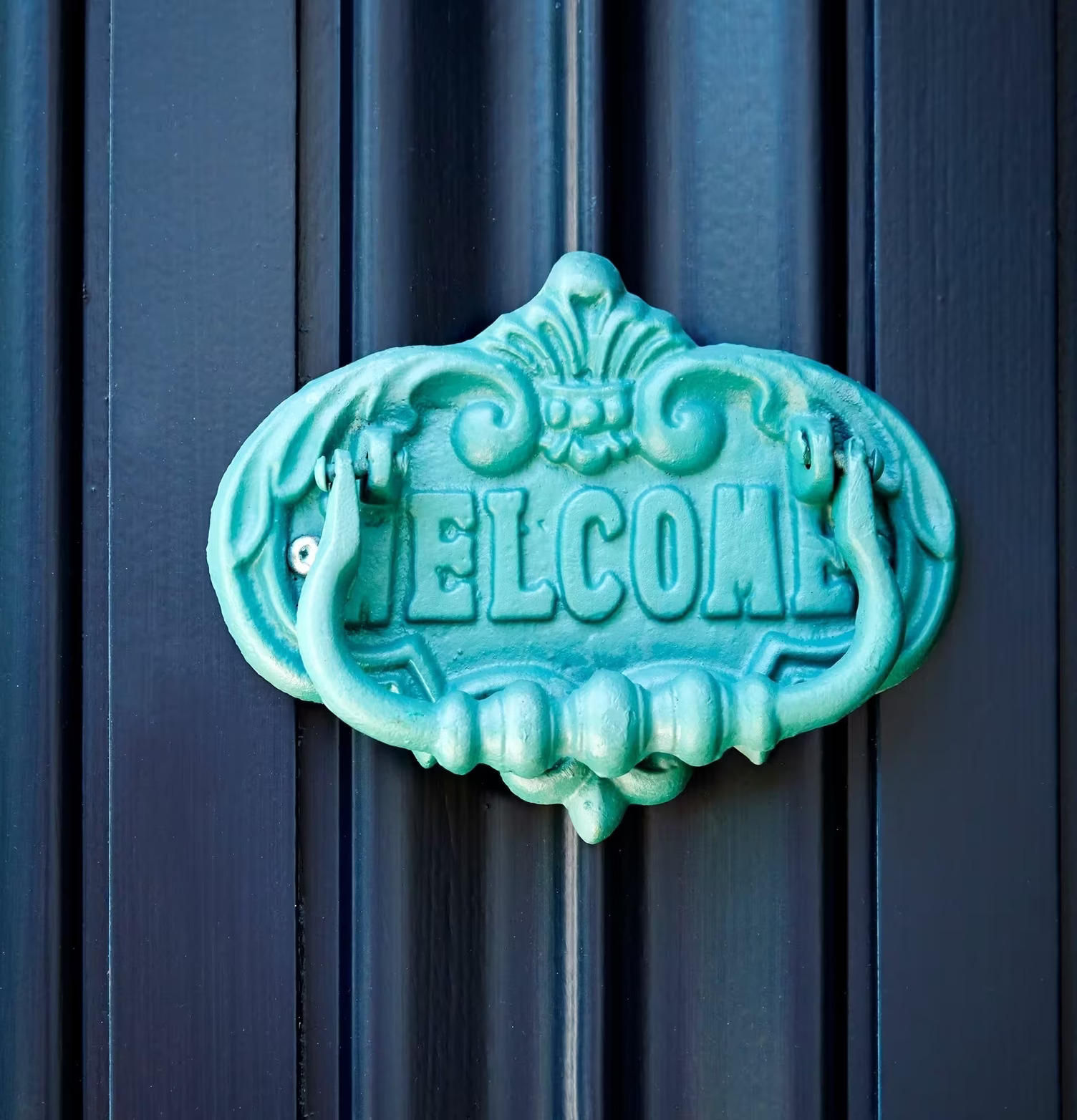 Dörrknackare Gul från Rice med WELCOME på mörk dörr