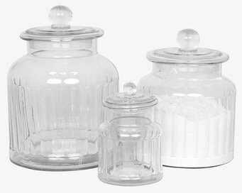 Bild av tre eleganta glasburkar med räfflad design